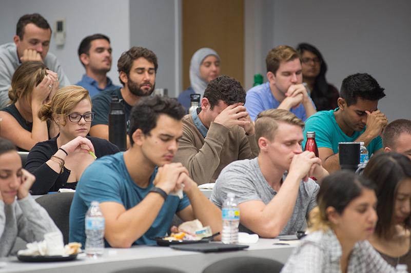 Students practicing mindfulness at stress management seminar